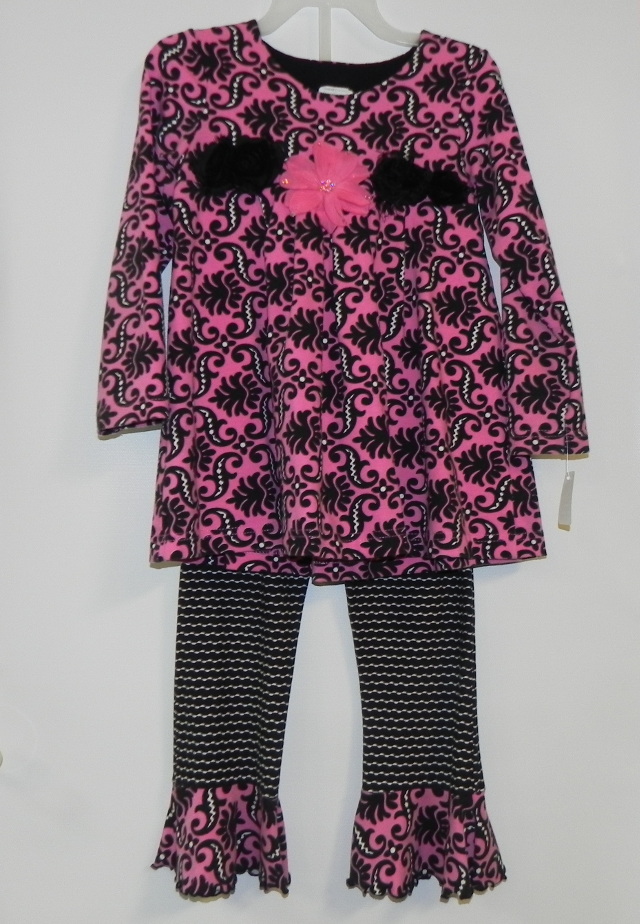 Peaches n Cream two-piece pant set with cotton/spandex pink/black long sleeve print top and black pants with matching cuff. Our Price $30